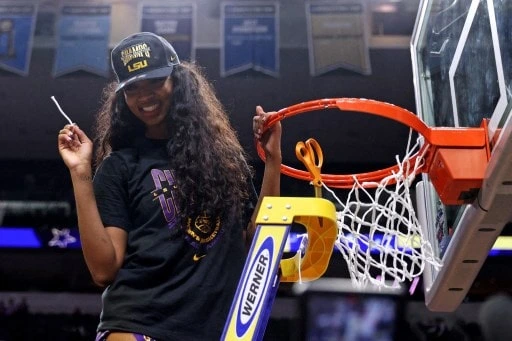 Angel Reese #10 of the LSU Lady Tigers cuts down a piece of the net - Meyer/Getty Images/AFP